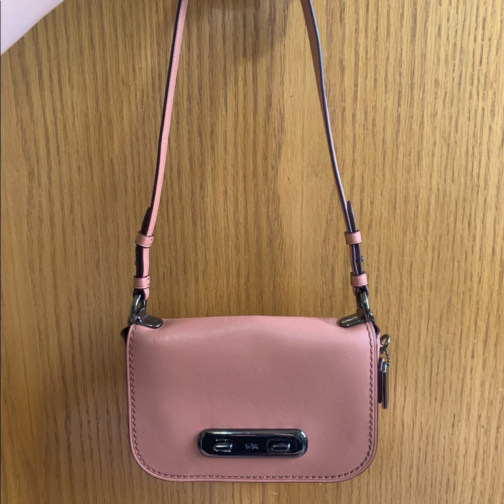 Pink crossbody Coach purse